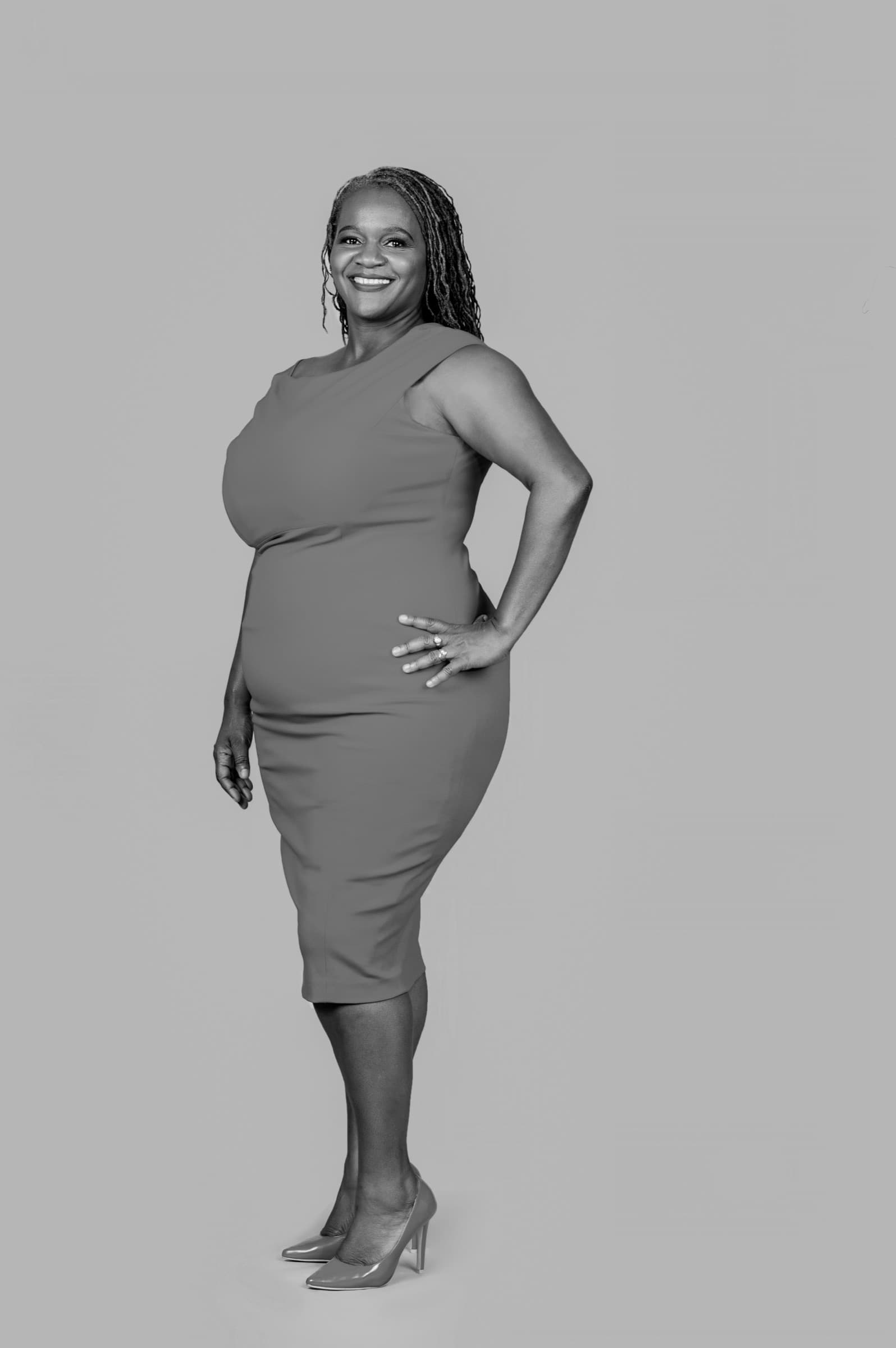 Clara Mlambo in a blue dress studio portrait.